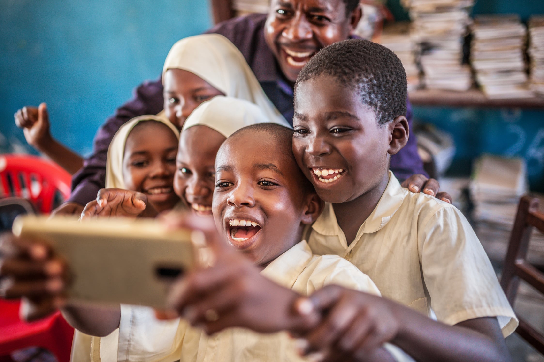african child taking selfie in classroom